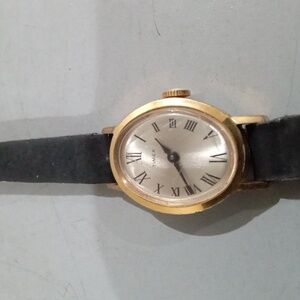 Vintage gold Timex steel manual wind watch